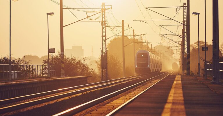 Passenger train at sunrise.